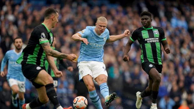 Erling Haaland pictured (center) shooting from outside of the 18-yard box to score for Manchester City against Brighton in October 2023