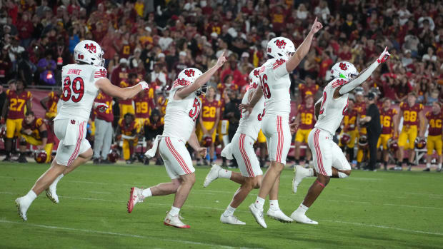 Oct 21, 2023; Los Angeles, California, USA; Utah Utes place kicker Cole Becker (36) celebrates after kicking 38-yard field goal out of the hold of punter Jack Bouwmeester (34) as time expires against the Southern California Trojans at United Airlines Field at Los Angeles Memorial Coliseum. Mandatory Credit: Kirby Lee-USA TODAY Sports