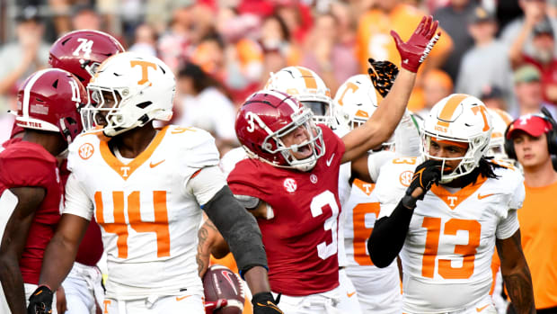 Alabama Crimson Tide wide receiver Jermaine Burton (3) celebrates amid Tennessee players after making a first down at Bryant-Denny Stadium. Alabama defeated Tennessee 34-20.