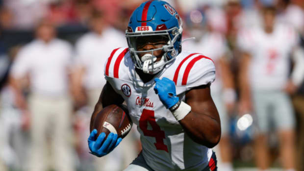 Ole Miss Rebels running back Quinshon Judkins on a rushing attempt during a college football game in the SEC.
