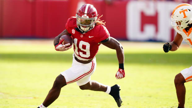 Oct 21, 2023; Tuscaloosa, Alabama, USA; Alabama Crimson Tide wide receiver Kendrick Law (19) carries up the field against the Tennessee Volunteers during the first half at Bryant-Denny Stadium.