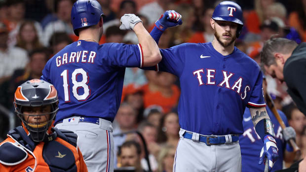 Oct 22, 2023; Houston, Texas, USA; Texas Rangers catcher Mitch Garver (18) reacts after hitting a home run against the Houston Astros in the second inning during game six of the ALCS for the 2023 MLB playoffs at Minute Maid Park. Mandatory Credit: Troy Taormina-USA TODAY Sports