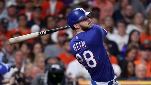 Oct 22, 2023; Houston, Texas, USA; Texas Rangers catcher Jonah Heim (28) hits a two run home run against the Houston Astros in the fourth inning during game six of the ALCS for the 2023 MLB playoffs at Minute Maid Park. Mandatory Credit: Troy Taormina-USA TODAY Sports