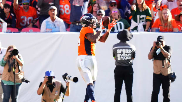 Denver Broncos wide receiver Courtland Sutton (14) pulls in a touchdown in the second half against the Green Bay Packers at Empower Field at Mile High.