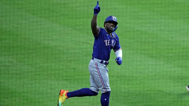 Oct 22, 2023; Houston, Texas, USA; Texas Rangers right fielder Adolis Garcia (53) reacts after hitting a grand slam against Houston Astros relief pitcher Ryne Stanek (45) in the ninth inning during game six of the ALCS for the 2023 MLB playoffs at Minute Maid Park.