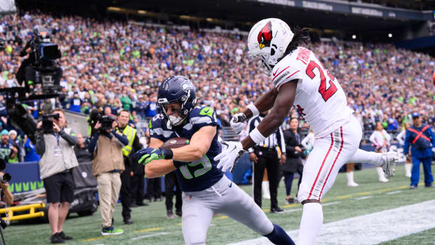 Seattle Seahawks wide receiver Jake Bobo (19) catches a pass for a touchdown over Arizona Cardinals cornerback Starling Thomas V (24) during the first half at Lumen Field.