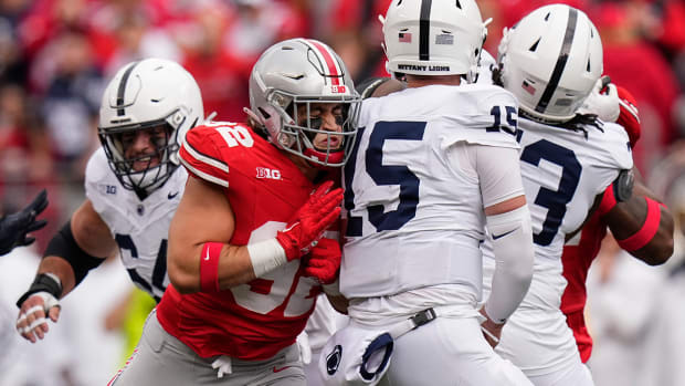 Ohio State defensive end Caden Curry hits Penn State quarterback Drew Allar on Oct. 21, 2023, in Columbus.