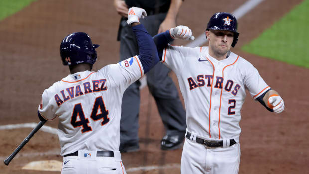 Oct 23, 2023; Houston, Texas, USA; Houston Astros third baseman Alex Bregman (2) celebrates with left fielder Yordan Alvarez (44) after hitting a home run during the third inning of game seven in the ALCS against the Texas Rangers for the 2023 MLB playoffs at Minute Maid Park. Mandatory Credit: Erik Williams-USA TODAY Sports