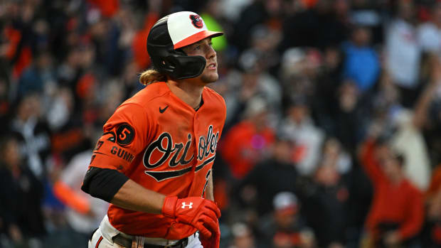 Oct 8, 2023; Baltimore, Maryland, USA; Baltimore Orioles third baseman Gunnar Henderson (2) hits a home run during the fifth inning against the Texas Rangers during game two of the ALDS for the 2023 MLB playoffs at Oriole Park at Camden Yards. Mandatory Credit: Tommy Gilligan-USA TODAY Sports