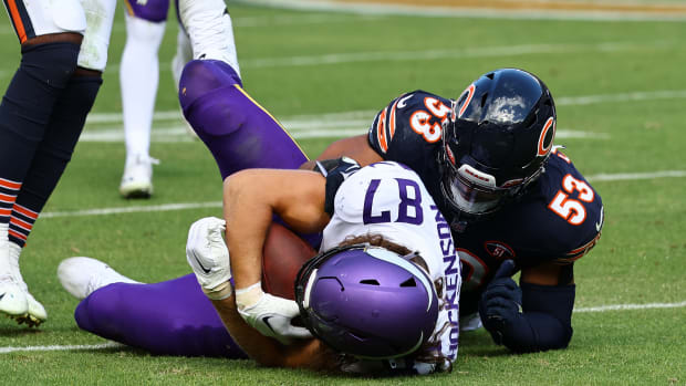 Oct 15, 2023; Chicago, Illinois, USA; Chicago Bears linebacker T.J. Edwards (53) tackles Minnesota Vikings tight end T.J. Hockenson (87) during the second half at Soldier Field.