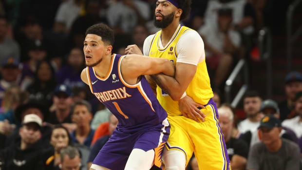 Apr 5, 2022; Phoenix, Arizona, USA; Los Angeles Lakers forward Anthony Davis (3) against Phoenix Suns guard Devin Booker (1) at Footprint Center. Mandatory Credit: Mark J. Rebilas-USA TODAY Sports