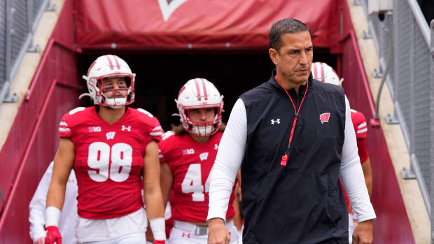 Oct 14, 2023; Madison, Wisconsin, USA; Wisconsin Badgers head coach Luke Fickell leads the football team onto the field for warmups prior to the game against the Iowa Hawkeyes at Camp Randall Stadium. Mandatory Credit: Jeff Hanisch-USA TODAY Sports