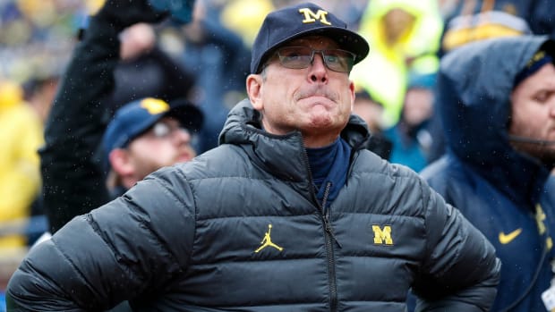 Michigan coach Jim Harbaugh looks on from the sidelines during the Wolverines’ game against Indiana.