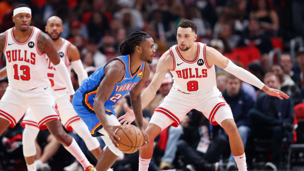 Oct 25, 2023; Chicago, Illinois, USA; Chicago Bulls guard Zach LaVine (8) defends against Oklahoma City Thunder guard Cason Wallace (22) during the first half of a basketball game at United Center. Mandatory Credit: Kamil Krzaczynski-USA TODAY Sports