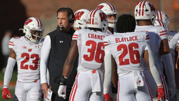 Oct 21, 2023; Champaign, Illinois, USA; Wisconsin Badgers head coach Luke Fickell with his players during the first half against the Illinois Fighting Illini at Memorial Stadium. Mandatory Credit: Ron Johnson-USA TODAY Sports