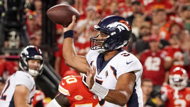 Denver Broncos quarterback Russell Wilson (3) throws a pass against the Kansas City Chiefs during the first half at GEHA Field at Arrowhead Stadium.
