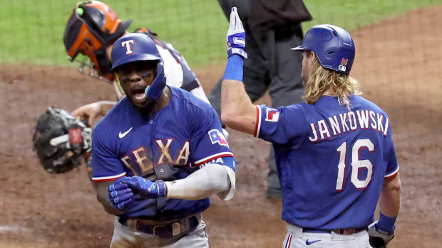 Rangers’ Adolis Garcia high fives Travis Jankowski after hitting a home run vs. the Astros in the ALCS.