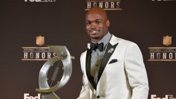 Adrian Peterson accepts an award at NFL Honors.