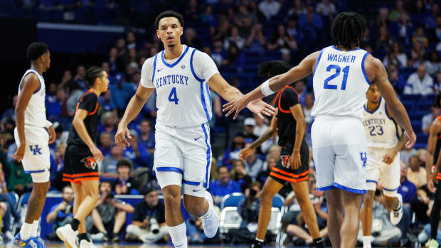 Oct 27, 2023; Lexington, KY, USA; Kentucky Wildcats forward Tre Mitchell (4) greets guard D.J. Wagner (21) during the first half against the Georgetown Tigers at Rupp Arena. Mandatory Credit: Jordan Prather-USA TODAY Sports