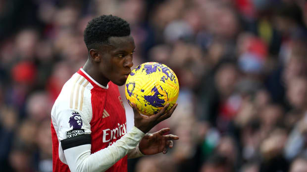 Eddie Nketiah pictured kissing the match ball after scoring a hat-trick for Arsenal against Sheffield United in October 2023
