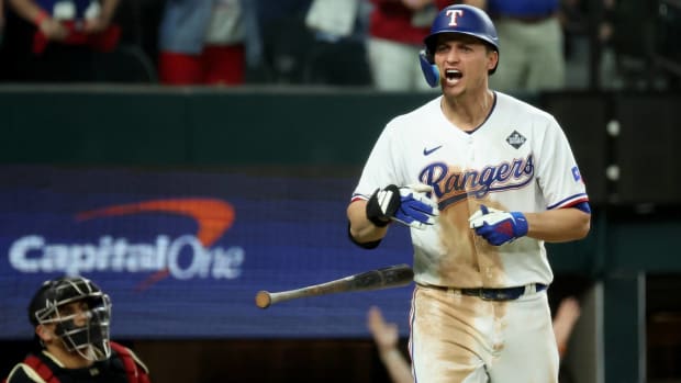 Rangers shortstop Corey Seager screams after hitting a home run in Game 1 of the 2023 World Series.
