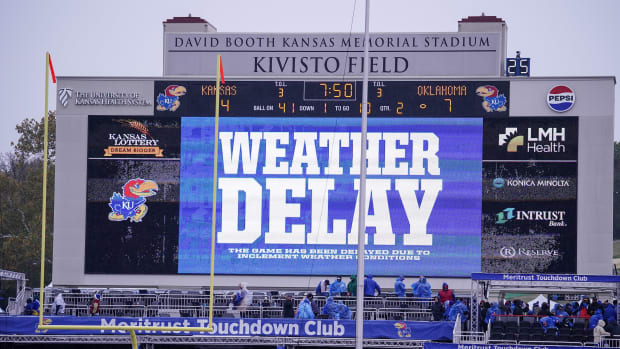 Oct 28, 2023; Lawrence, Kansas, USA; A general view of the scoreboard showing the current weather delay during the first half of the game between the Kansas Jayhawks and Oklahoma Sooners at David Booth Kansas Memorial Stadium. Mandatory Credit: Denny Medley-USA TODAY Sports  