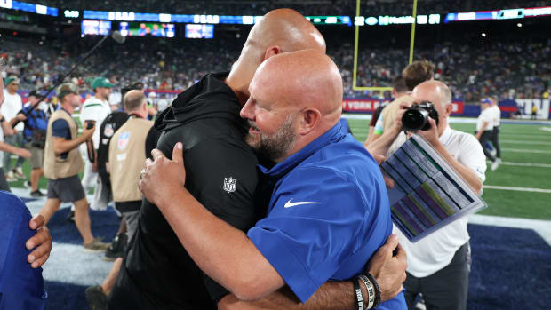 Jets' head coach Robert Saleh and Giants' head coach Brian Daboll meet at midfield