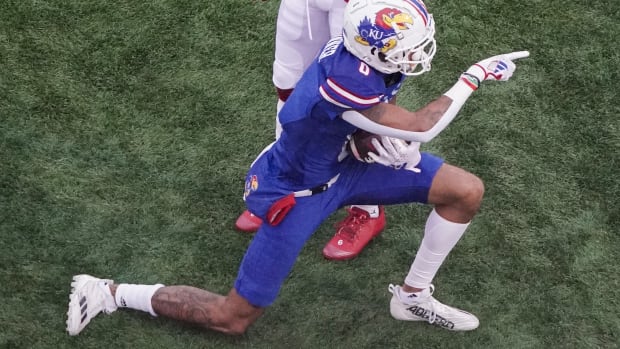 Oct 28, 2023; Lawrence, Kansas, USA; Kansas Jayhawks wide receiver Quentin Skinner (0) celebrates after a catch against the Oklahoma Sooners during the first half at David Booth Kansas Memorial Stadium.