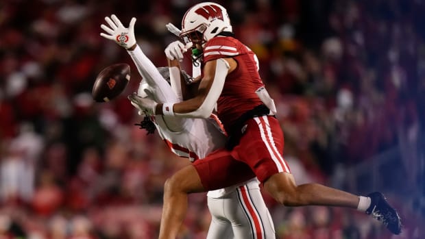 Oct 28, 2023; Madison, Wisconsin, USA; Ohio State Buckeyes cornerback Denzel Burke (10) breaks up a pass intended for Wisconsin Badgers wide receiver Bryson Green (9) during the second half of the NCAA football game at Camp Randall Stadium. Ohio State won 24-10.