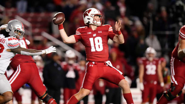 Oct 28, 2023; Madison, Wisconsin, USA; Wisconsin Badgers quarterback Braedyn Locke (18) throws a pass during the second half of the NCAA football game against the Ohio State Buckeyes at Camp Randall Stadium. Ohio State won 24-10.