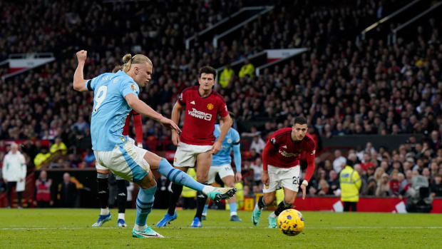 Erling Haaland pictured converting a penalty kick for Manchester City against Manchester United at Old Trafford in October 2023