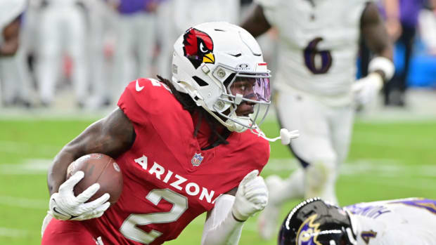Arizona Cardinals wide receiver Marquise Brown (2) runs with the ball as Baltimore Ravens cornerback Marlon Humphrey (44) defends in the first half at State Farm Stadium.