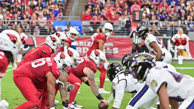 The Arizona Cardinals offensive line squares off against the Baltimore Ravens defensive line in the first half at State Farm Stadium.