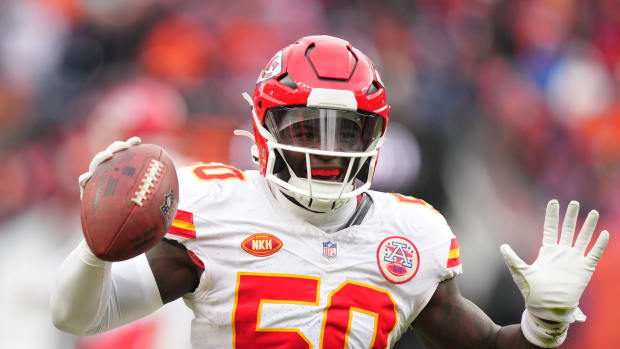 Oct 29, 2023; Denver, Colorado, USA; Kansas City Chiefs linebacker Willie Gay (50) celebrates his fumble recovery in the second quarter against the Denver Broncos at Empower Field at Mile High. Mandatory Credit: Ron Chenoy-USA TODAY Sports  