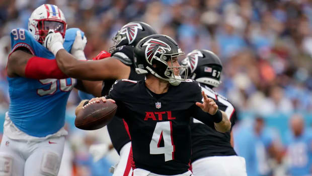 Atlanta Falcons quarterback Taylor Heinicke (4) looks for a receiver against the Tennessee Titans during the third quarter at Nissan Stadium in Nashville, Tenn., Sunday, Oct. 29, 2023.