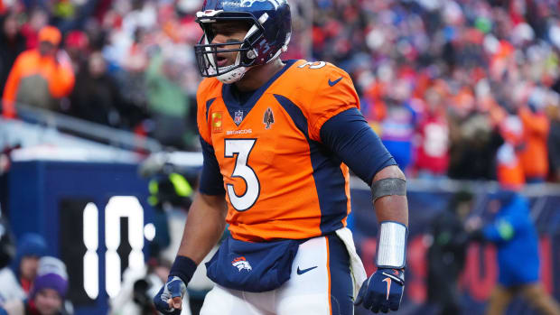 Denver Broncos quarterback Russell Wilson (3) celebrates a touchdown pass in the fourth quarter against the Kansas City Chiefs at Empower Field at Mile High.