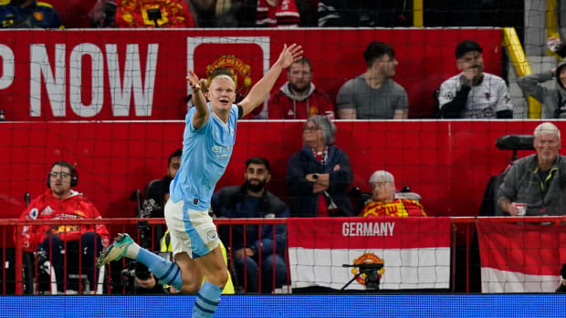 Manchester City striker Erling Haaland pictured celebrating after scoring the 20th away goal of his EPL career during a game against Manchester United in October 2023