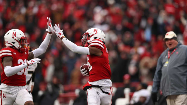 Nebraska defensive backs Tommi Hill (left) and Quinton Newsome (right) high five during a return against Purdue (Oct. 28, 2023)