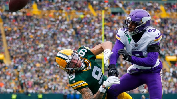 Oct 29, 2023; Green Bay, Wisconsin, USA; Minnesota Vikings cornerback Mekhi Blackmon (5) breaks up a pass intended for Green Bay Packers wide receiver Christian Watson (9) in the game at Lambeau Field.