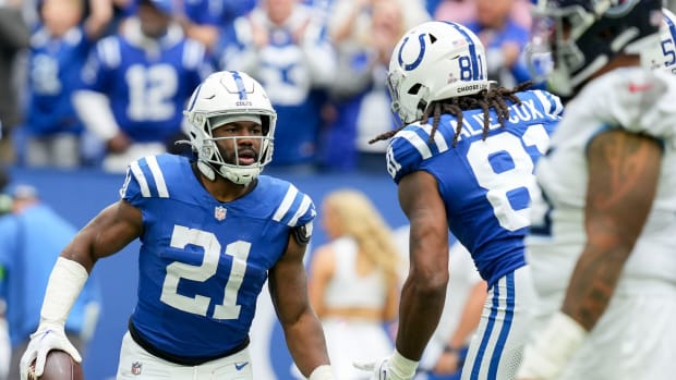 Indianapolis Colts running back Zack Moss (21) gets a high five from Indianapolis Colts tight end Mo Alie-Cox (81) after rushing for a touchdown Sunday, Oct. 8, 2023, during a game against the Tennessee Titans at Lucas Oil Stadium in Indianapolis.  