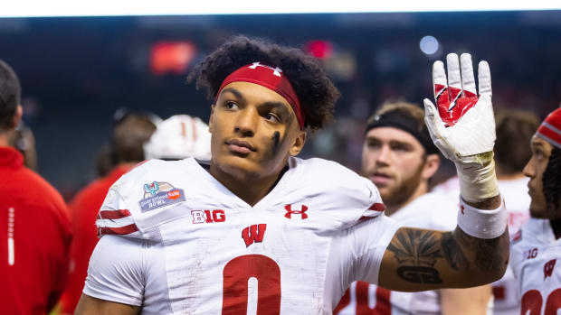 Dec 27, 2022; Phoenix, Arizona, USA; Wisconsin Badgers running back Braelon Allen (0) reacts against the Oklahoma State Cowboys in the second half of the 2022 Guaranteed Rate Bowl at Chase Field. Mandatory Credit: Mark J. Rebilas-USA TODAY Sports