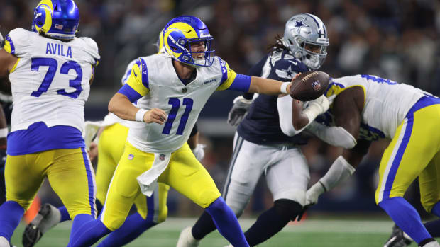 Oct 29, 2023; Arlington, Texas, USA; Los Angeles Rams quarterback Brett Rypien (11) pitches the ball in the third quarter against the Dallas Cowboys at AT&T Stadium. Mandatory Credit: Tim Heitman-USA TODAY Sports