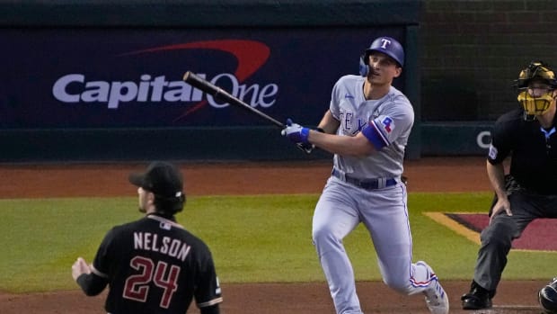 Oct 31, 2023; Phoenix, Arizona, USA; Texas Rangers shortstop Corey Seager (5) hits a two run home run against the Arizona Diamondbacks during the second inning in game four of the 2023 World Series at Chase Field. Mandatory Credit: Rick Scuteri-USA TODAY Sports