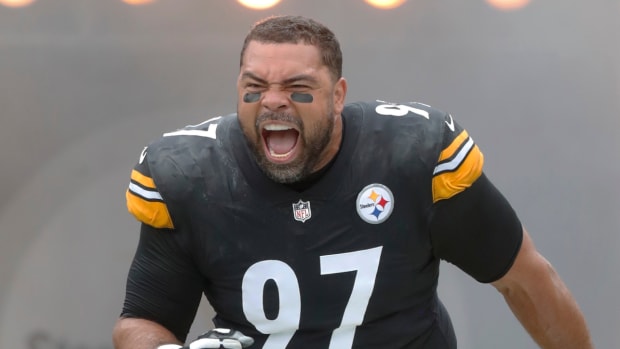 Steelers defensive tackle Cameron Heyward runs out of the tunnel before a game.
