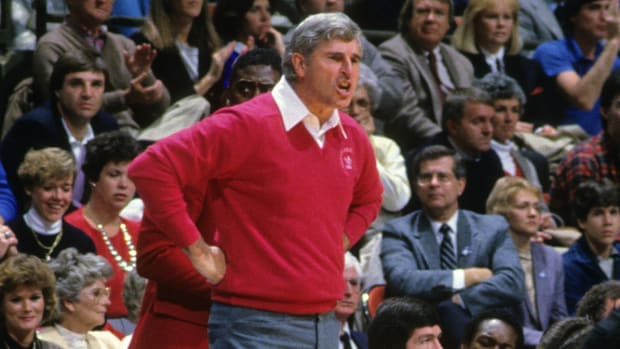 Indiana coach Bob Knight looks upset with his hands on his hips in a 1985 game