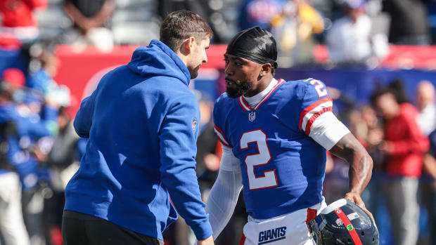 Oct 22, 2023; East Rutherford, New Jersey, USA; New York Giants quarterback Daniel Jones (left) talks with quarterback Tyrod Taylor (2) before the game against the Washington Commanders at MetLife Stadium.