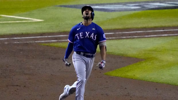 Nov 1, 2023; Phoenix, Arizona, USA; Texas Rangers second baseman Marcus Semien (2) reacts after hitting a home run against the Arizona Diamondbacks during the ninth inning in game five of the 2023 World Series at Chase Field.