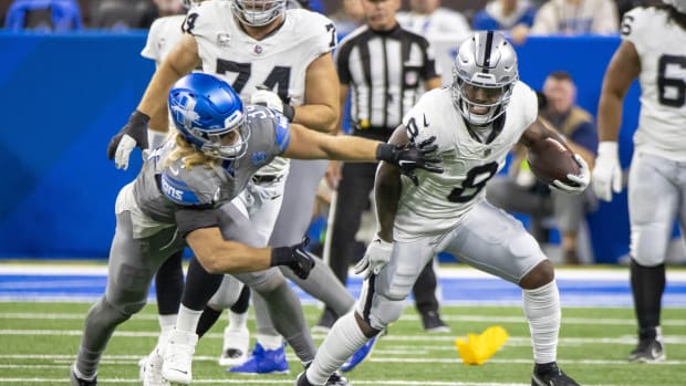 Oct 30, 2023; Detroit, Michigan, USA; Las Vegas Raiders running back Josh Jacobs (8) runs with the ball as Detroit Lions linebacker Alex Anzalone (34) chases during the first half at Ford Field.