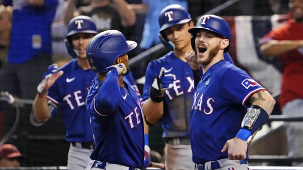 Texas Rangers second baseman Marcus Semien (2) celebrates with shortstop Corey Seager (5) after hitting a two run home run during the ninth inning against the Arizona Diamondbacks during game five of the 2023 World Series at Chase Field in Phoenix on Nov. 1, 2023.