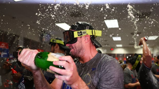 Texas Rangers starting pitcher Max Scherzer (31) celebrates in the locker room after winning the 2023 World Series in five games against the Arizona Diamondbacks at Chase Field.